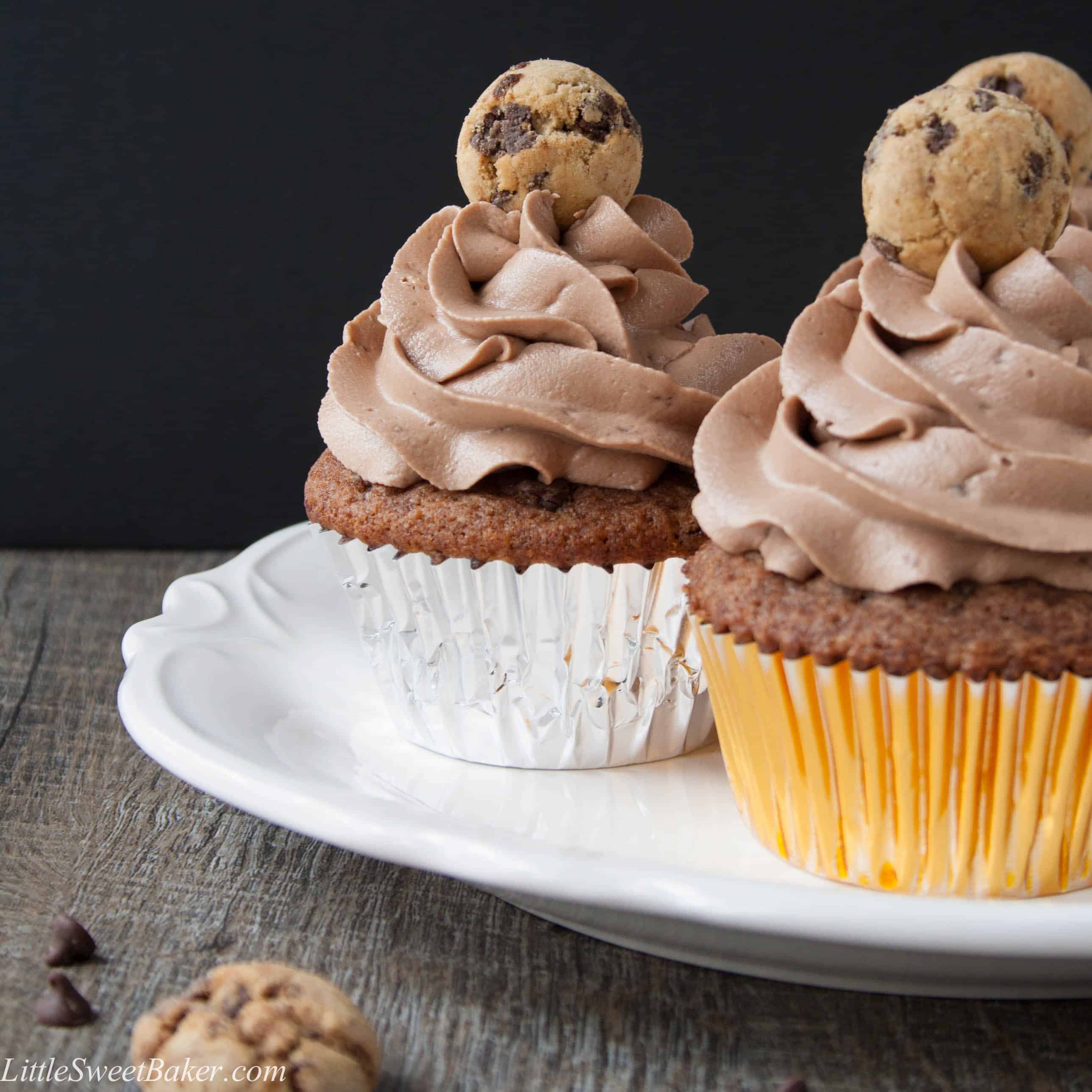 CHOCOLATE CHIP COOKIE CUPCAKES. A soft, moist and flavorful cookie butter cupcake topped with a chocolate cookie frosting. The ultimate chocolate chip cookie lover's dream!