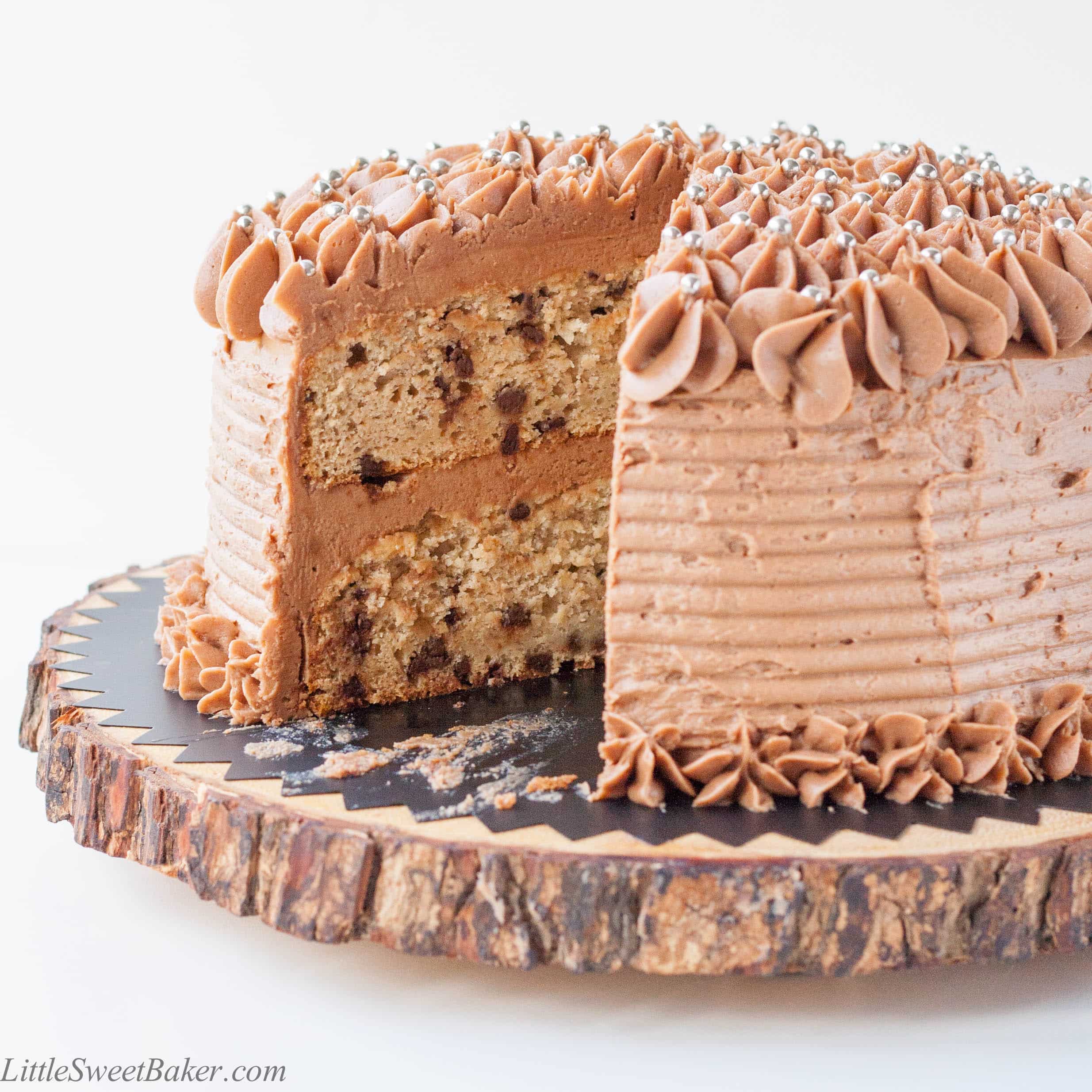 BANANA CHOCOLATE CHIP CAKE WITH MILK CHOCOLATE FROSTING. A deliciously moist chocolate chip banana cake surrounded with a real milk chocolate buttercream.