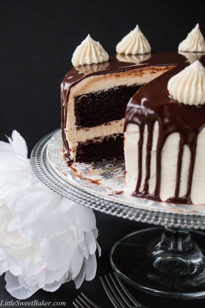 TRIPLE CHOCOLATE CAKE. A rich dark chocolate fudge cake surrounded with a creamy white chocolate buttercream and topped with a smooth chocolate ganache. This cake will have you saying "OMG!" It's that good.