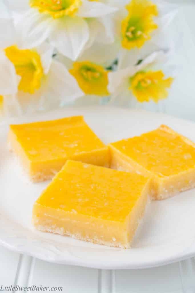 These heavenly tropical bars are made up of a tender crumbly coconut shortbread crust and topped with a fruity pineapple mango custard.