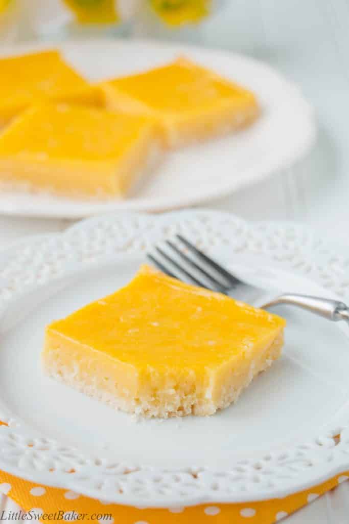 These heavenly tropical bars are made up of a tender crumbly coconut shortbread crust and topped with a fruity pineapple mango custard.